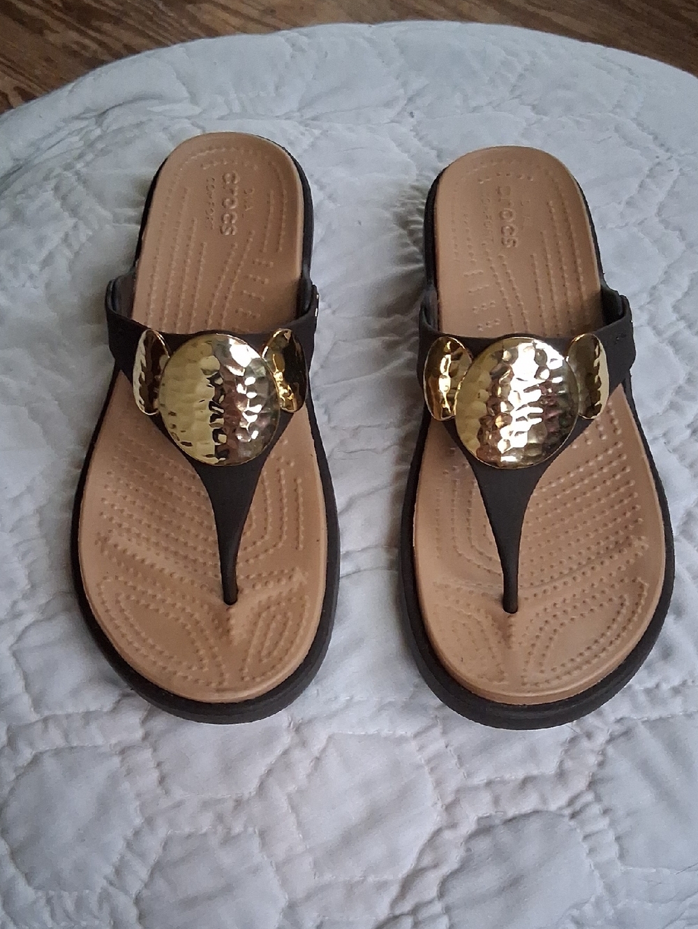 Crocs Women’s Black Thong Sandals with Gold Medallion